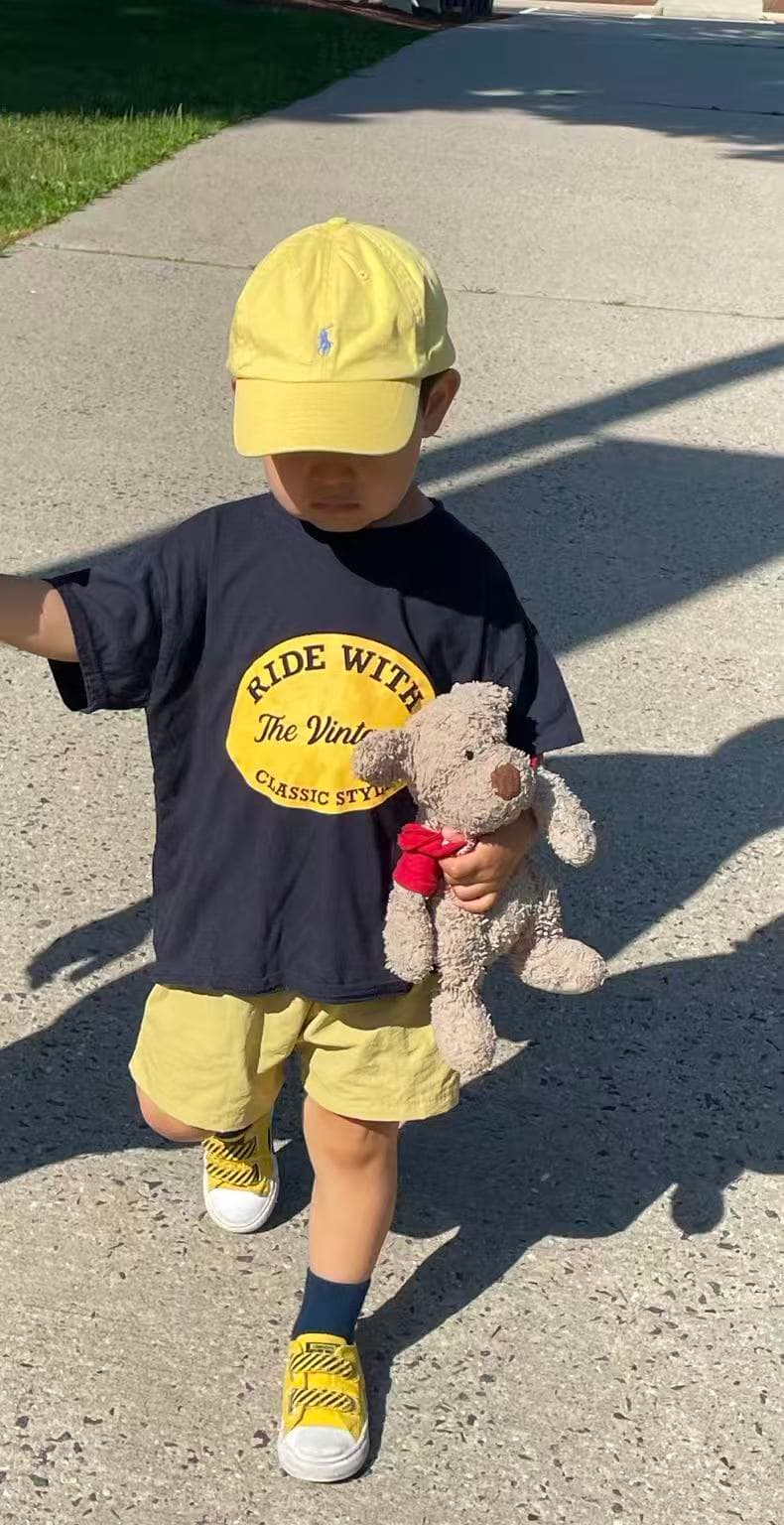 Lev DLY yellow cap stuffed dog walk
