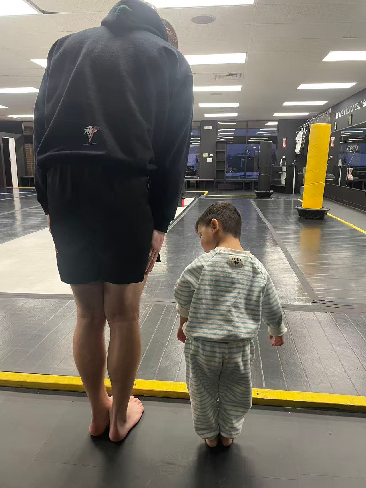 Lev MMA mat bow practice with coach