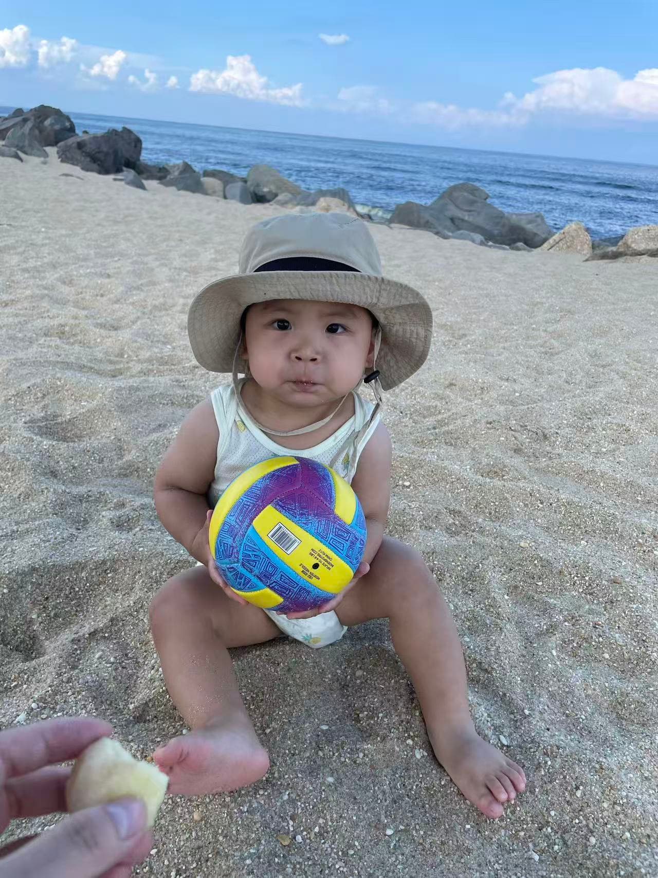 Lev REC beach ball seated portrait